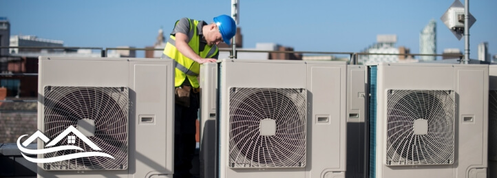 Technician working on rooftop units