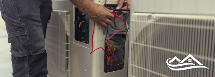 Technician working on a heat pump system