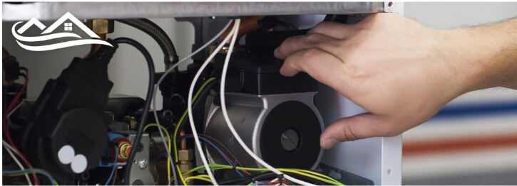 Technician working on a heating system