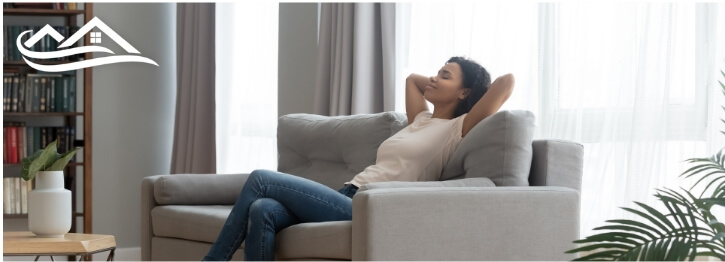 Woman laying down on a couch